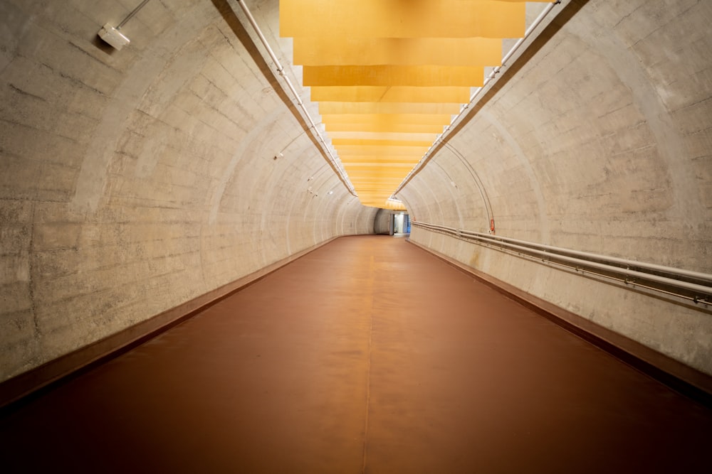 brown wooden hallway with yellow walls