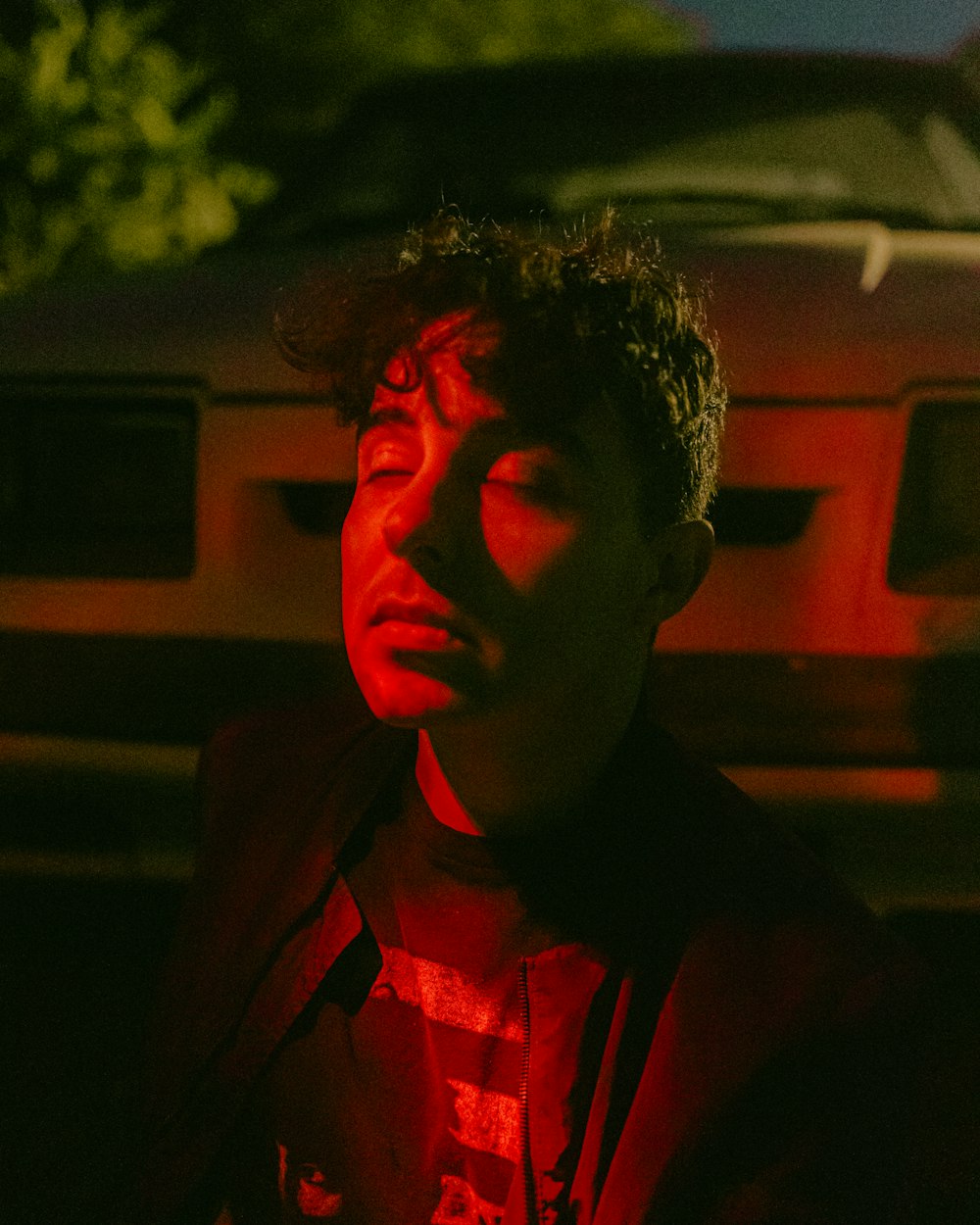 man in red collared shirt