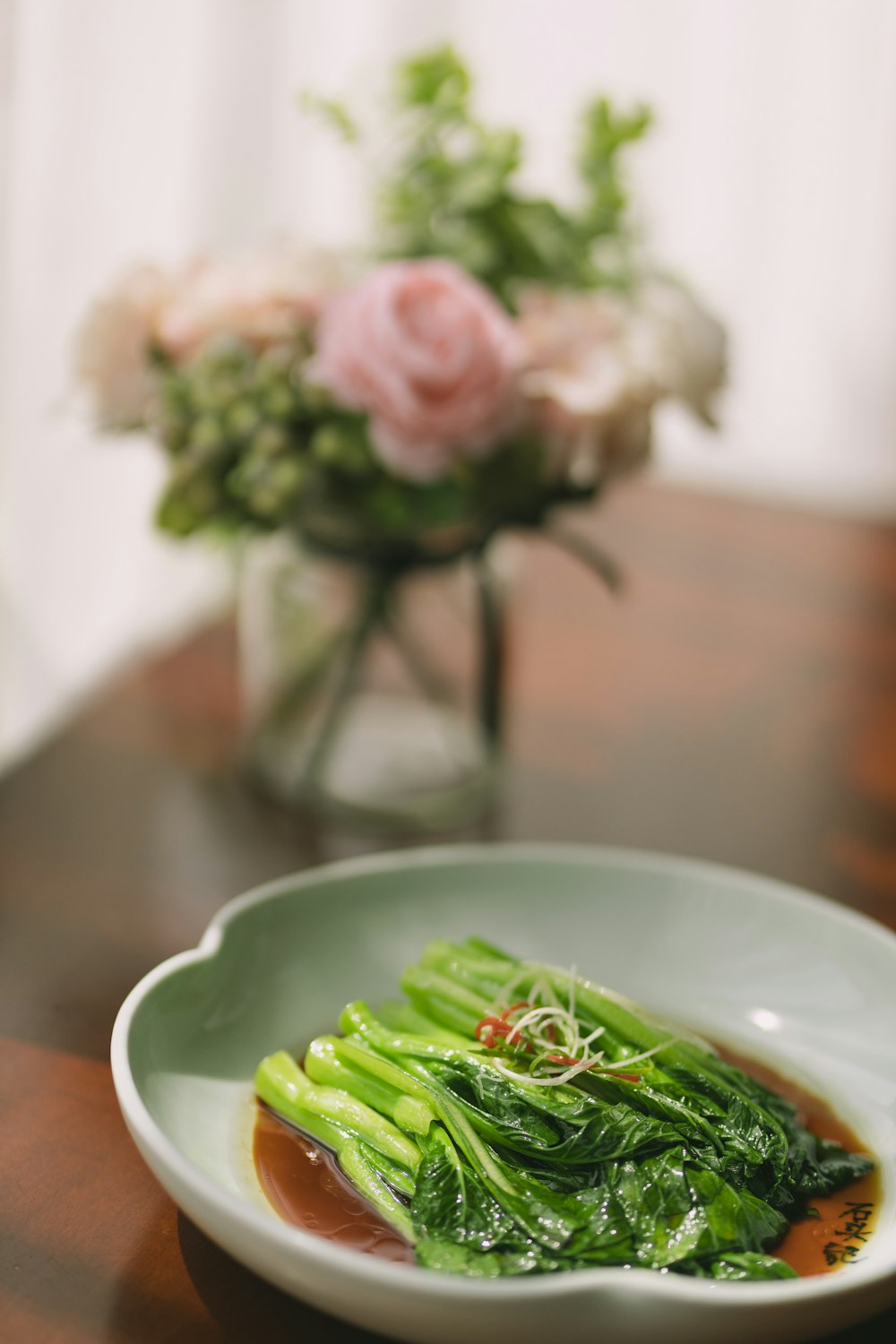 green vegetable on white ceramic plate