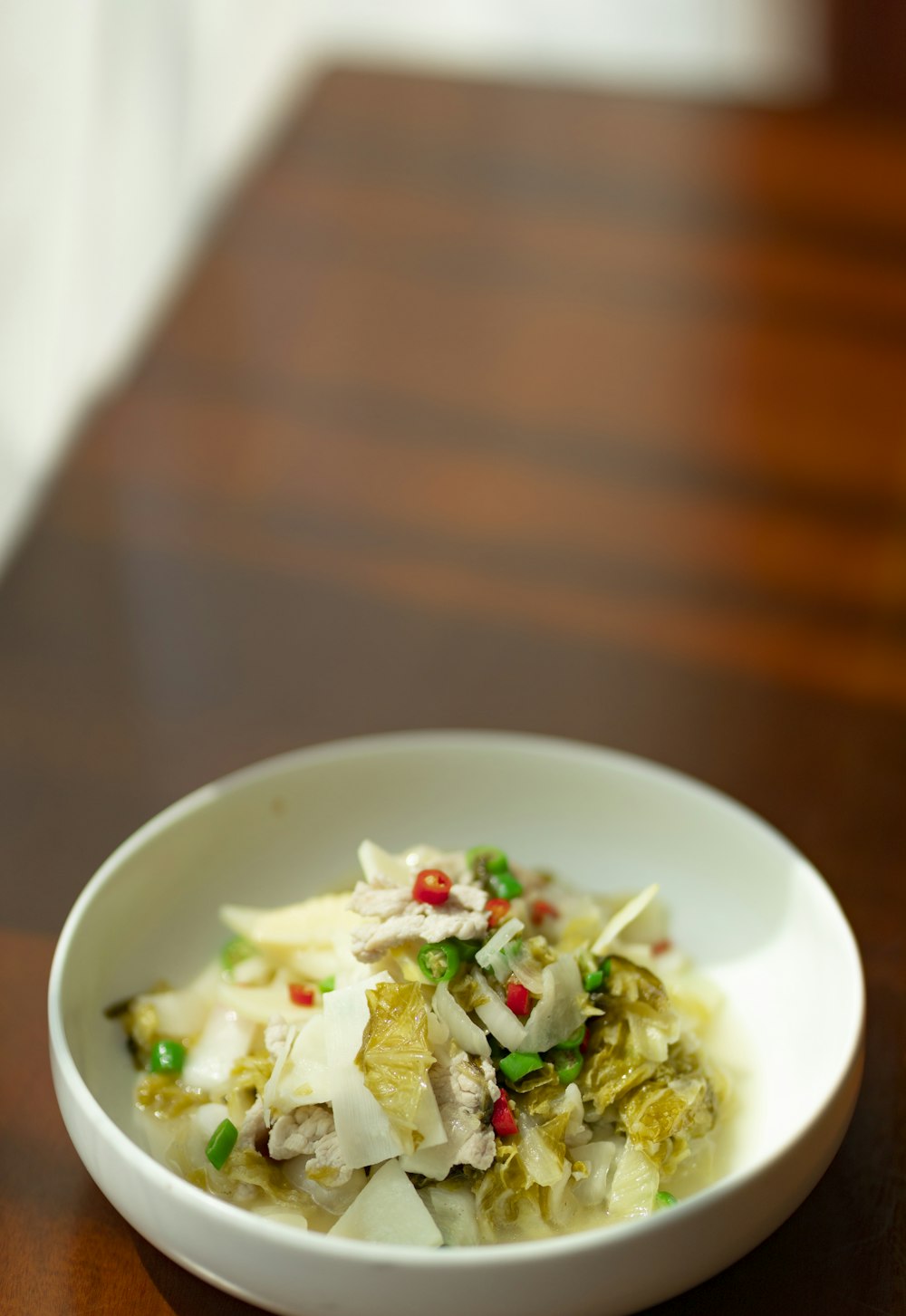 white ceramic bowl with green vegetable