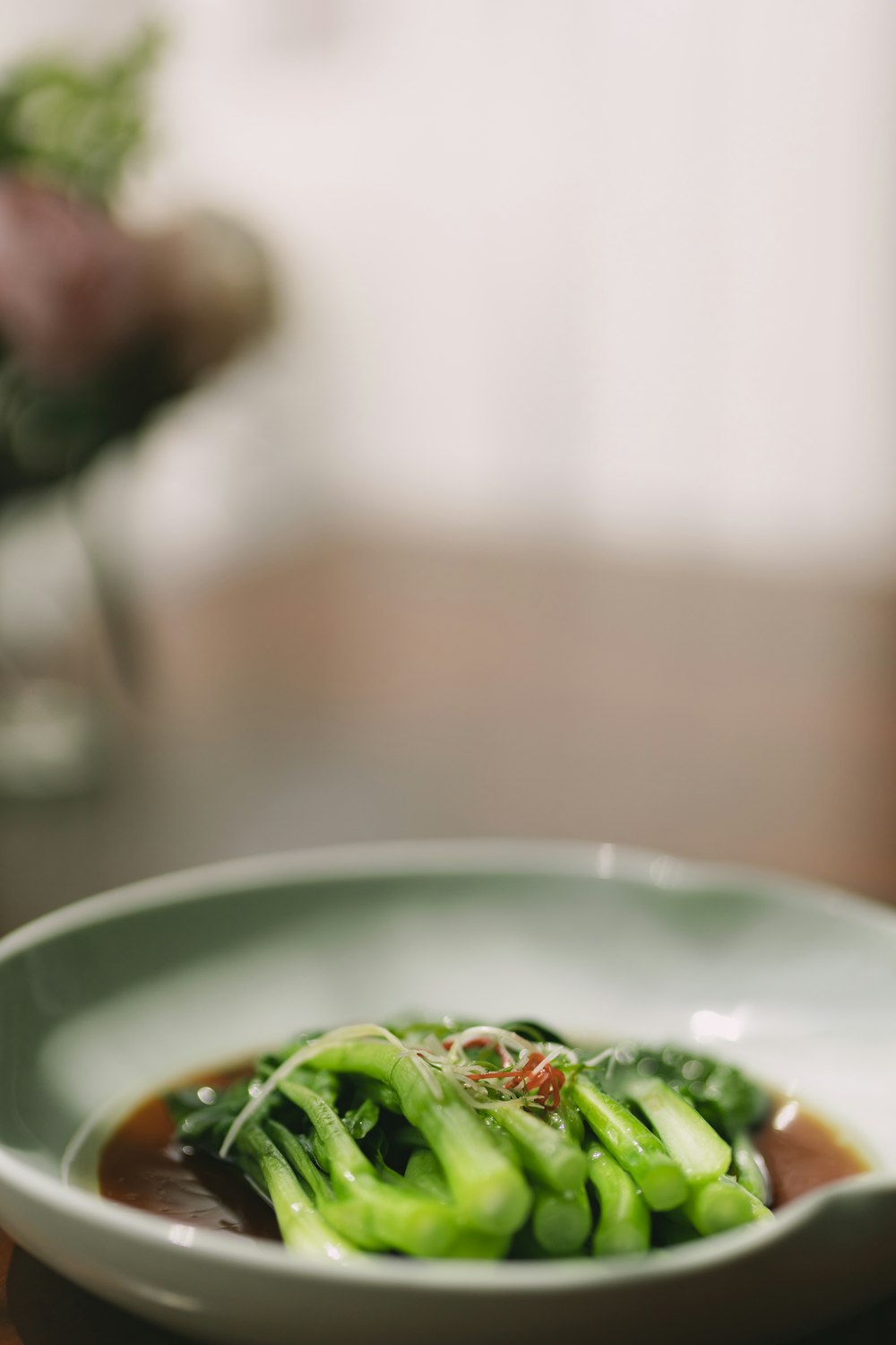 green vegetable on white ceramic plate