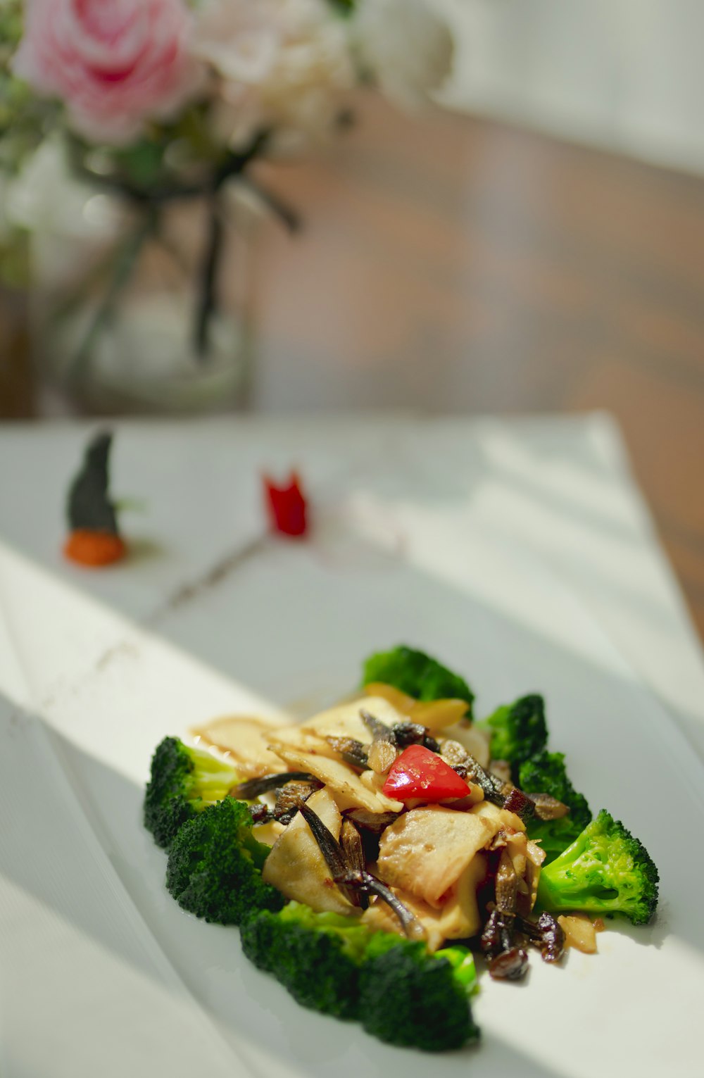 green vegetable on white ceramic plate