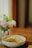 A close-up of a bowl filled with aromatic jasmine rice alongside fresh vegetables.