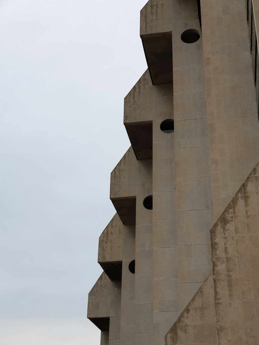 brown concrete building under blue sky during daytime