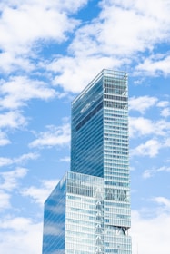 blue glass walled high rise building under blue sky during daytime