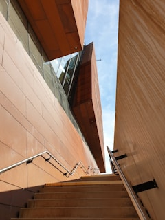 Wide shot of a sturdy steel staircase with sleek handrails inside a modern building.