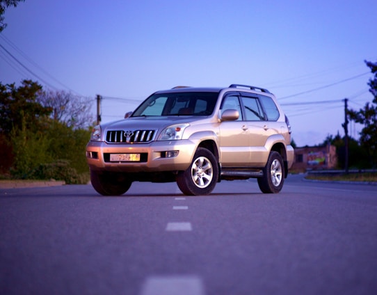 white suv on road during daytime