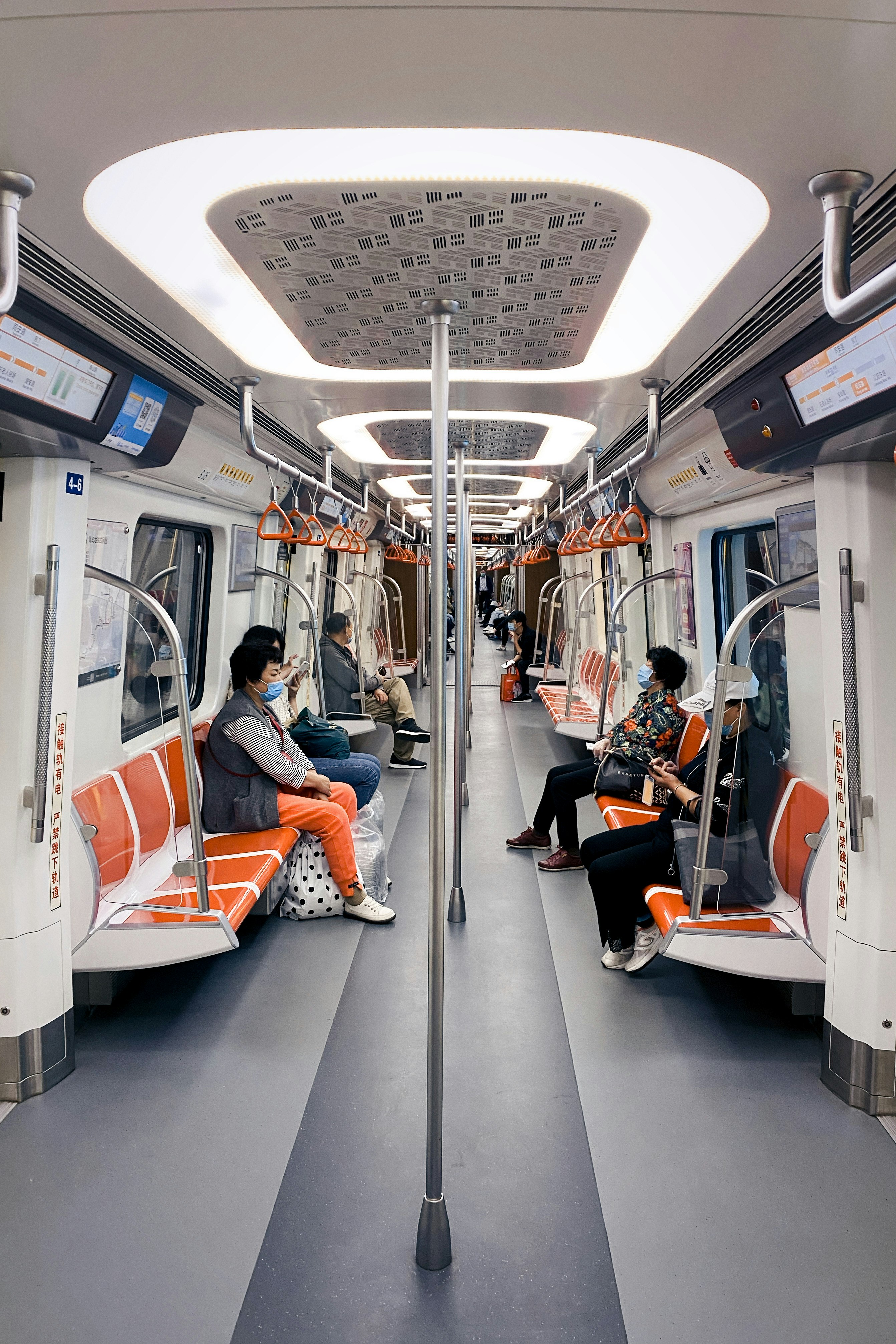 people sitting on train seat