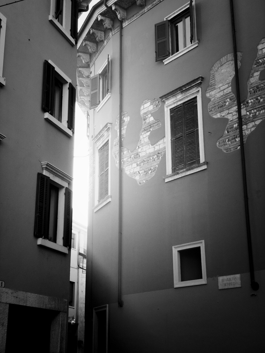 white window type air conditioner on white wall