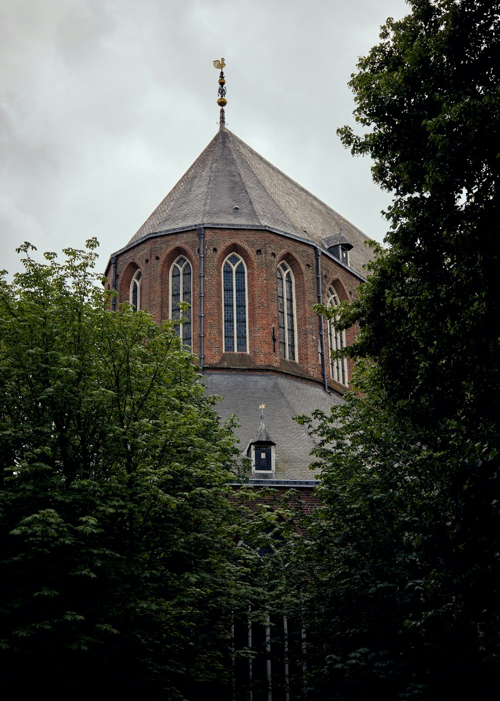 brown and gray concrete church under blue sky