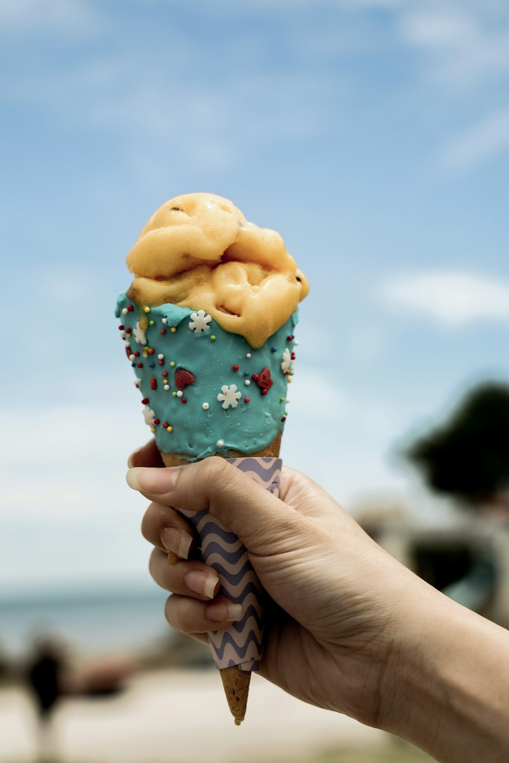 person holding ice cream cone