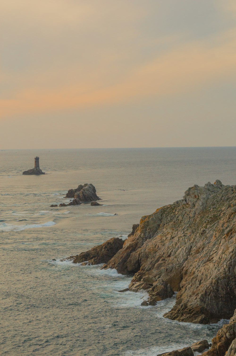 brown rock formation on sea during daytime