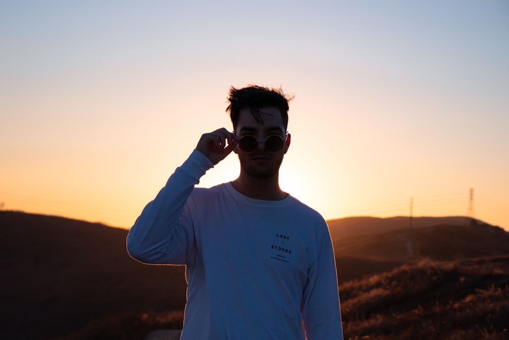 man in white crew neck t-shirt wearing black goggles