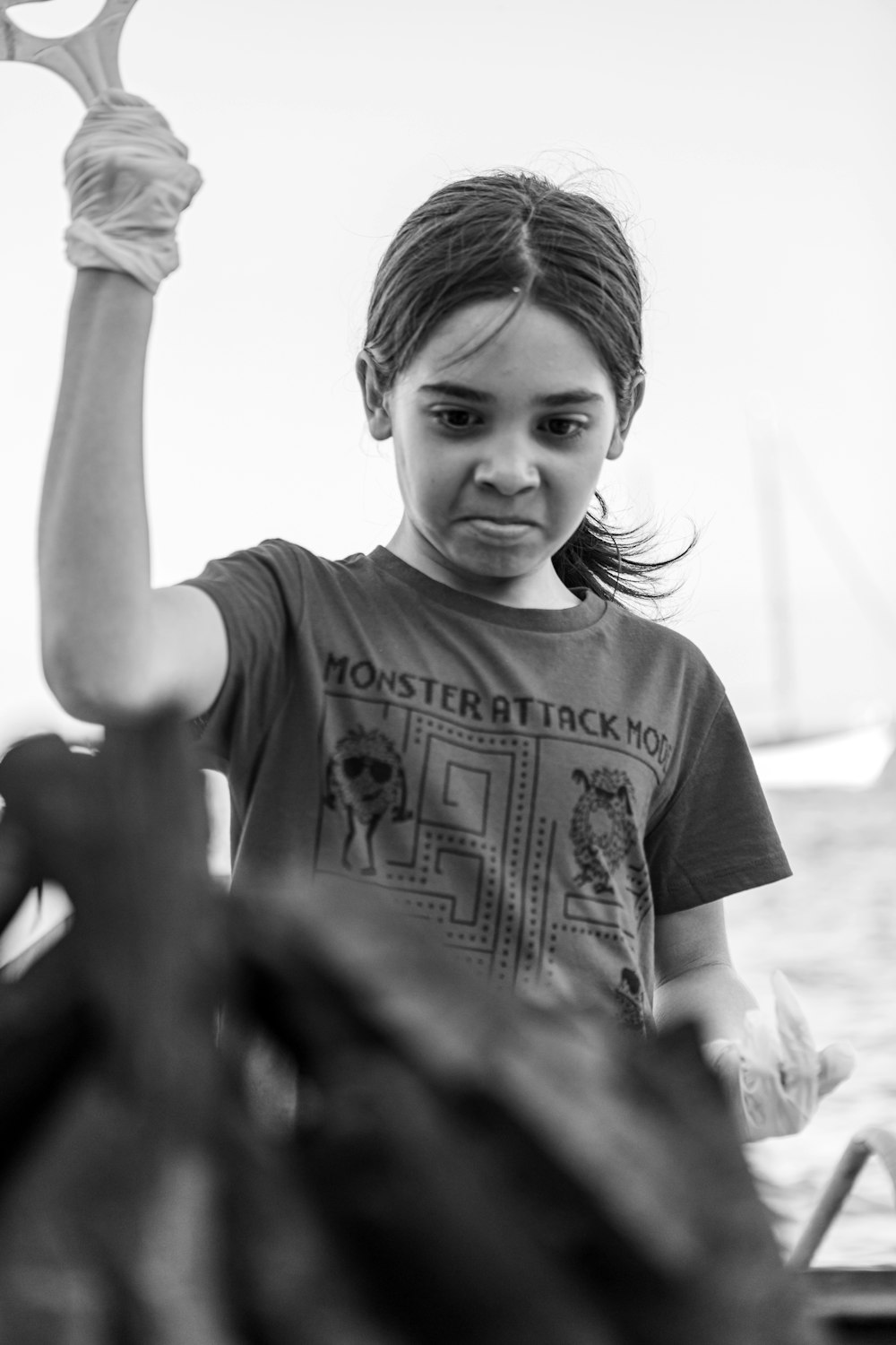 a young girl holding up a pair of scissors