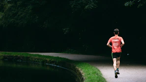 Happy person enjoying a morning jog in nature, symbolizing healthy lifestyle with Java Burn