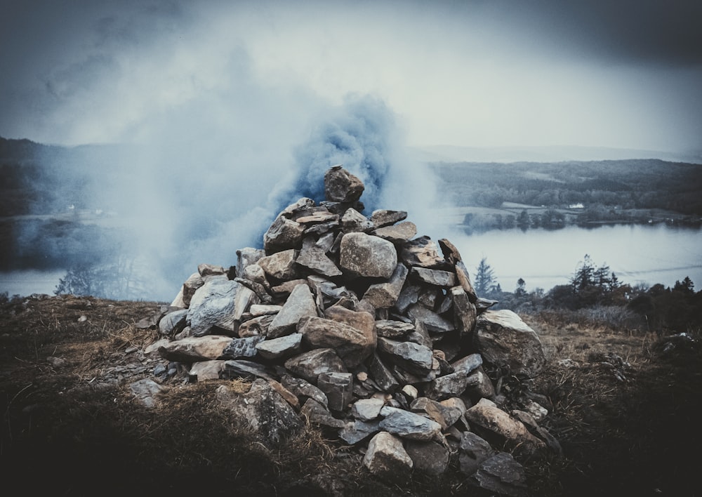 a pile of rocks sitting on top of a hill