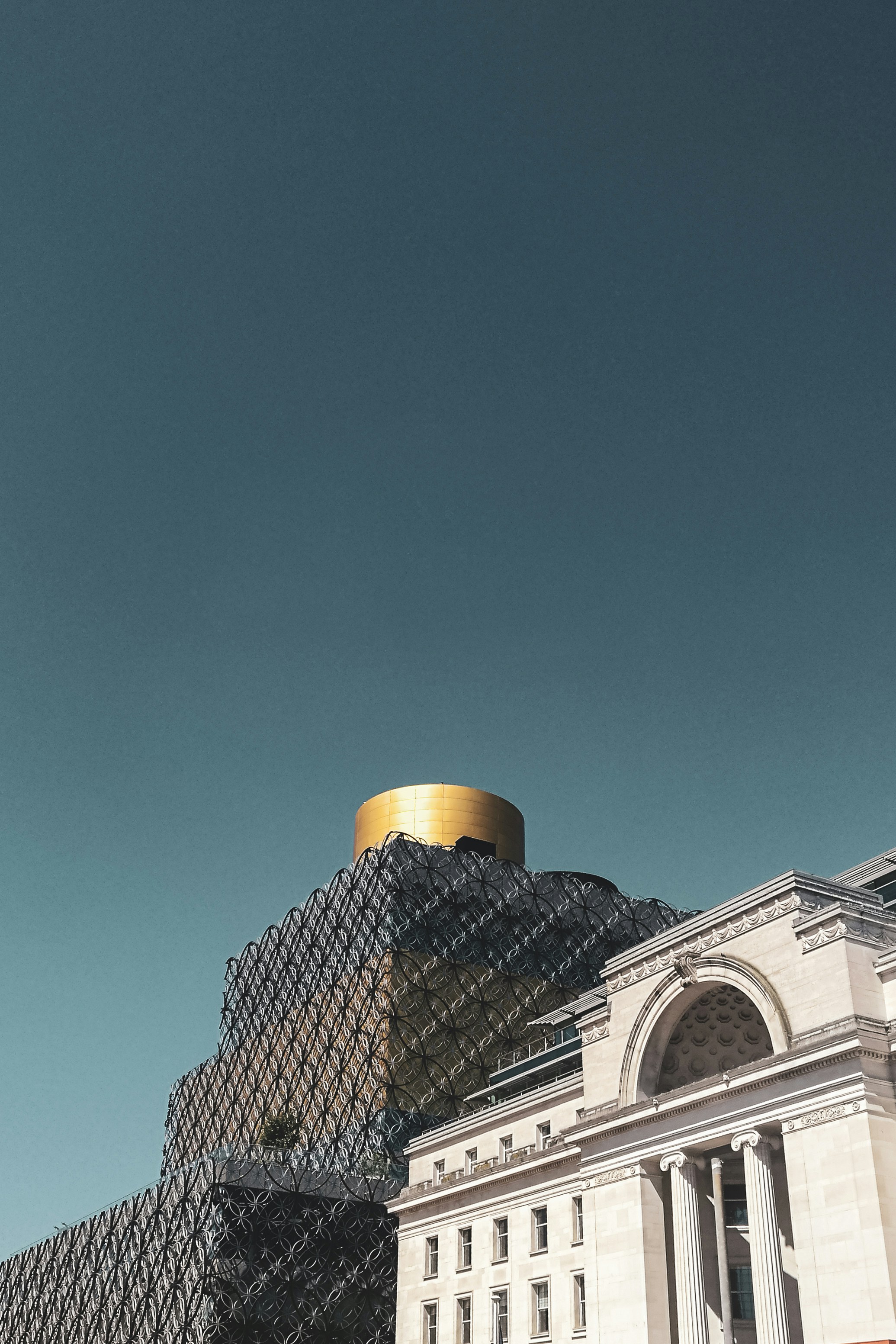 white and black concrete building under blue sky during daytime