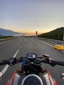 A sunset view over the mountains, captured during a motorcycle trip.