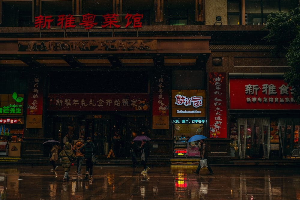 people walking on street during nighttime