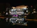 Elegant waterfront property with glowing architectural lights and illuminated garden beds.