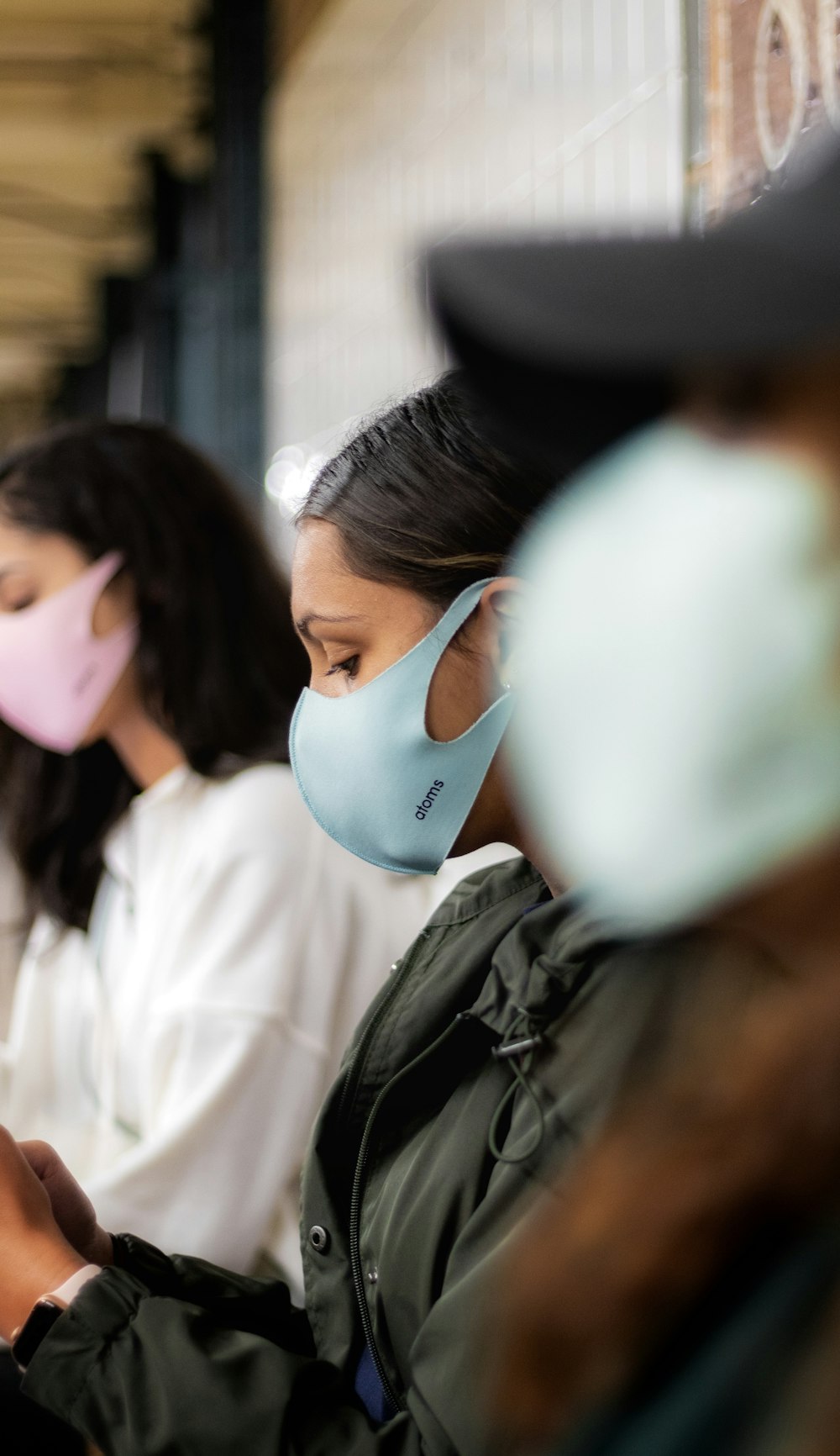 woman in white shirt wearing white mask