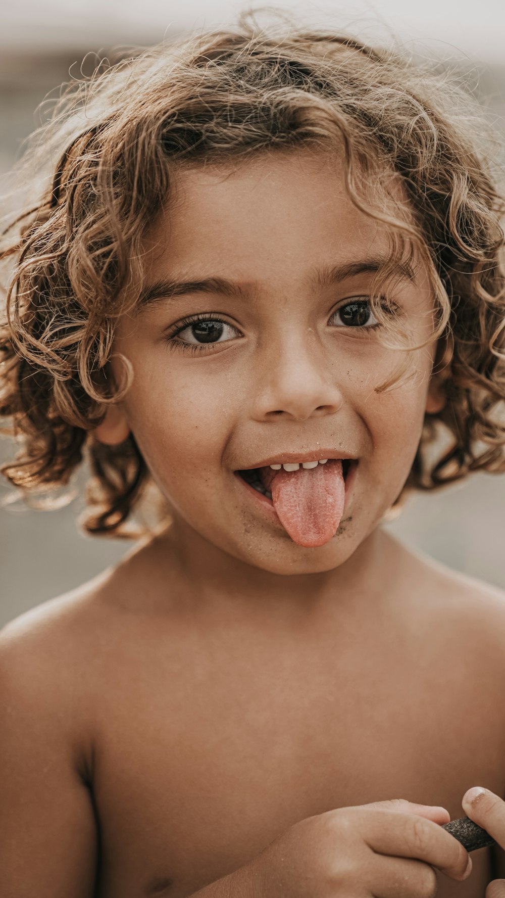 girl with brown hair smiling