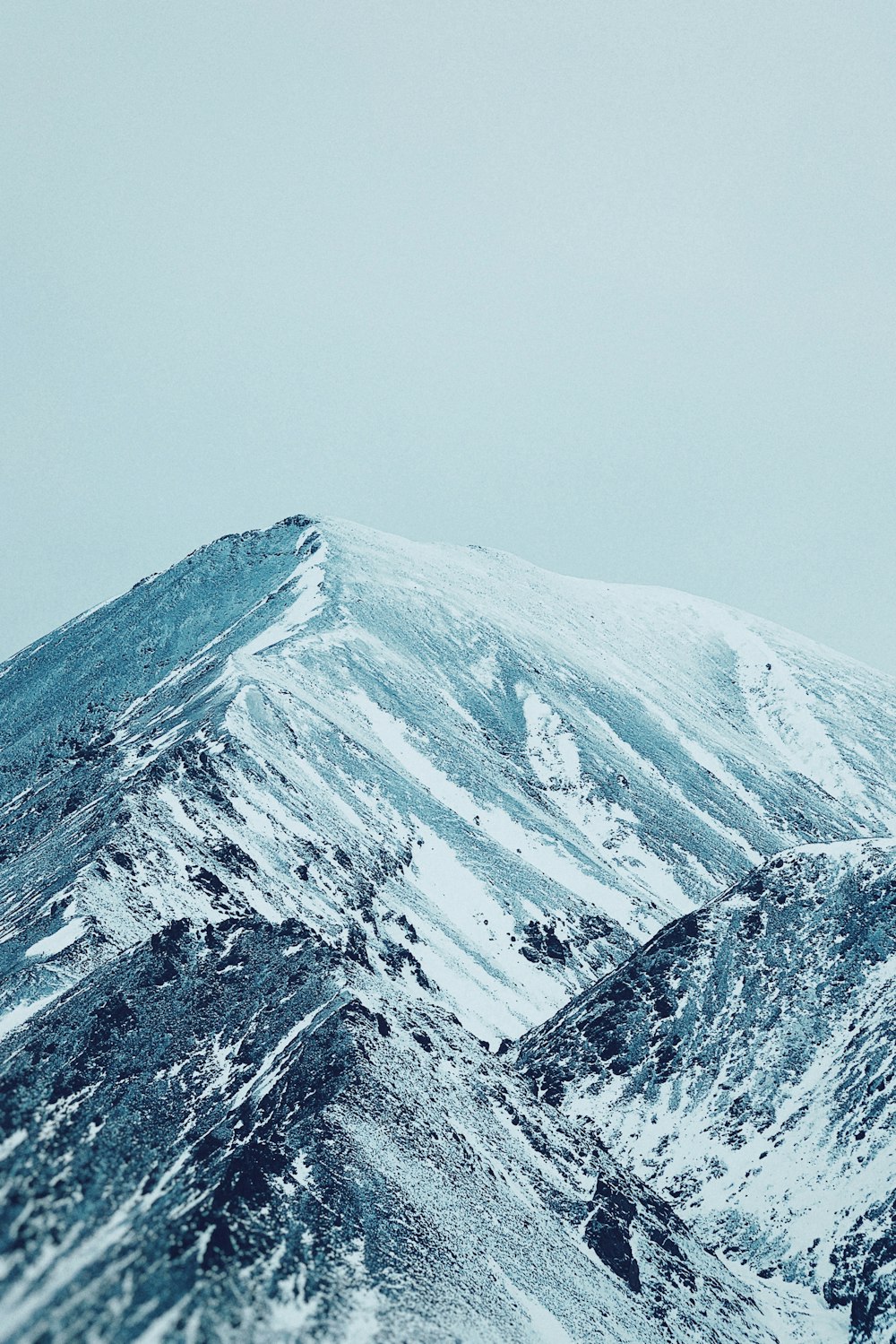 brown and white mountain under blue sky during daytime