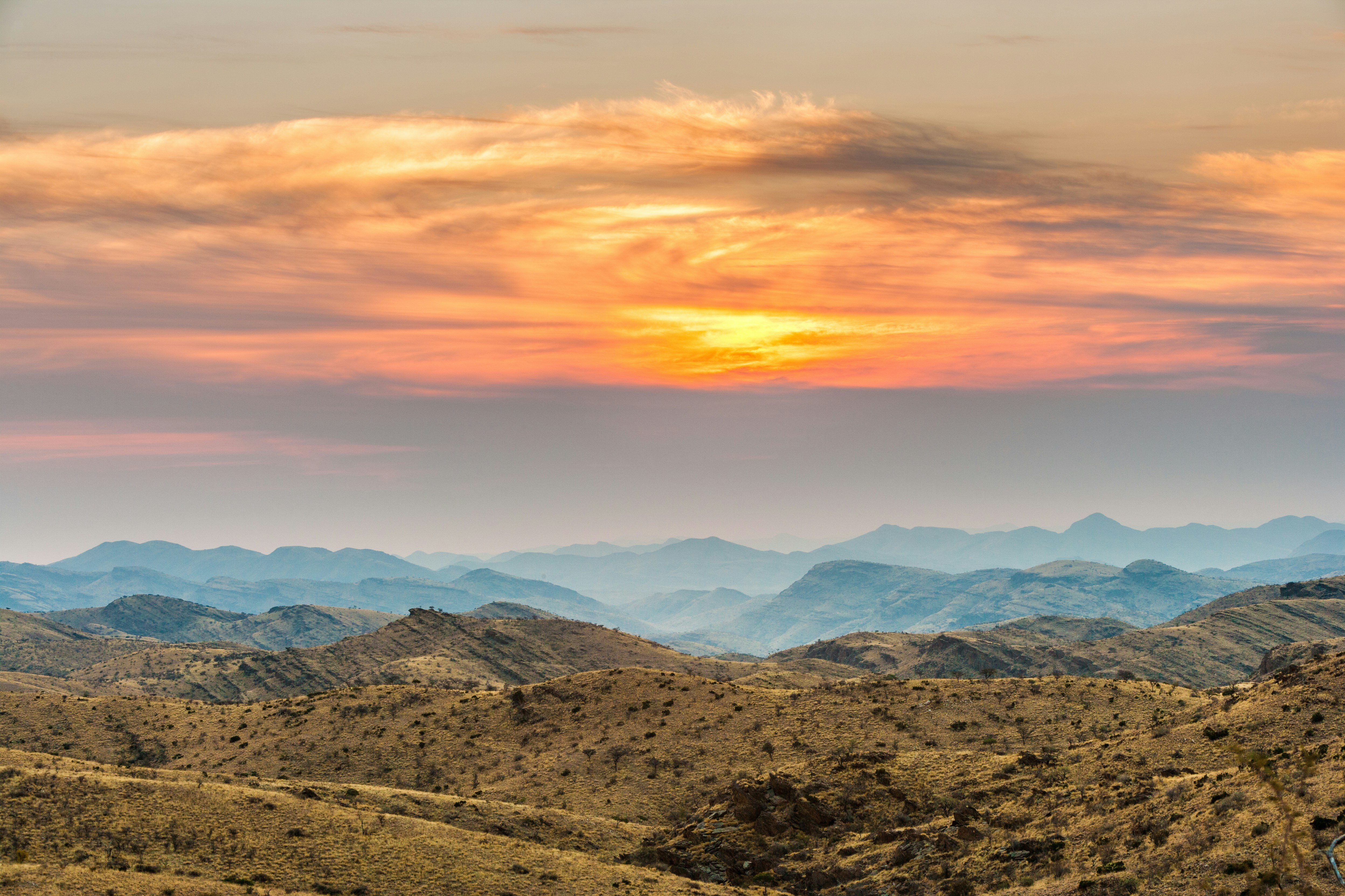 brown mountains under white clouds during daytime, Mountain landscape in the Gamsberg pass at early morning just after sunrise.