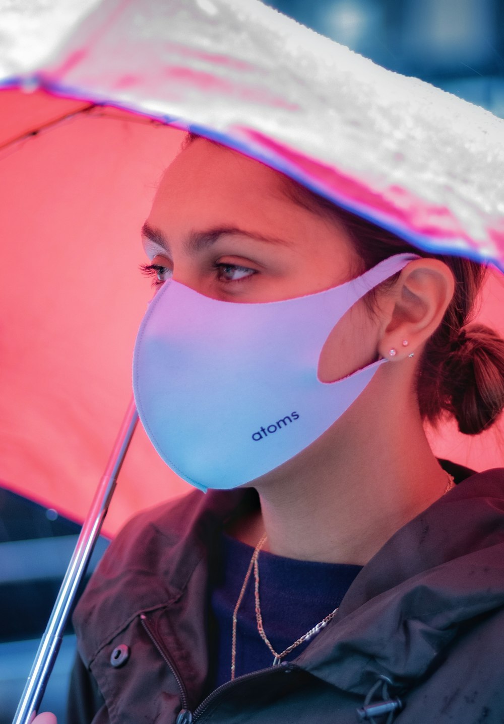 woman in white mask and black jacket