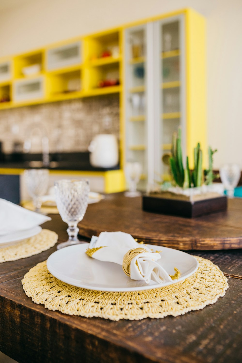 clear glass bowl on white ceramic plate