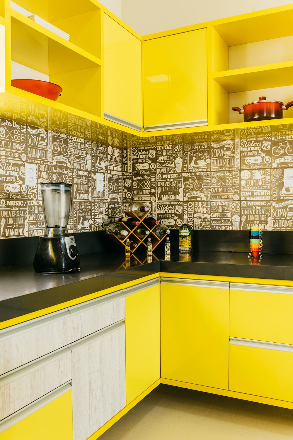 stainless steel coffee maker on black granite counter top