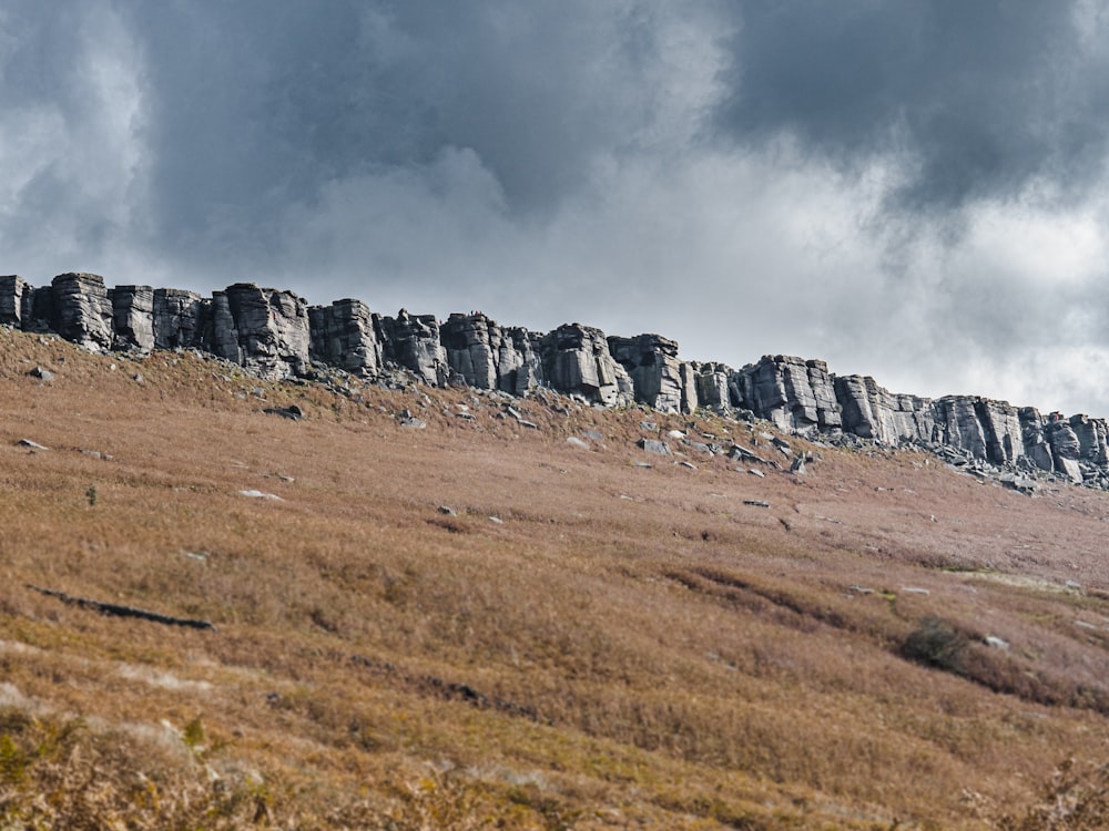 gray rock formation under gray clouds
