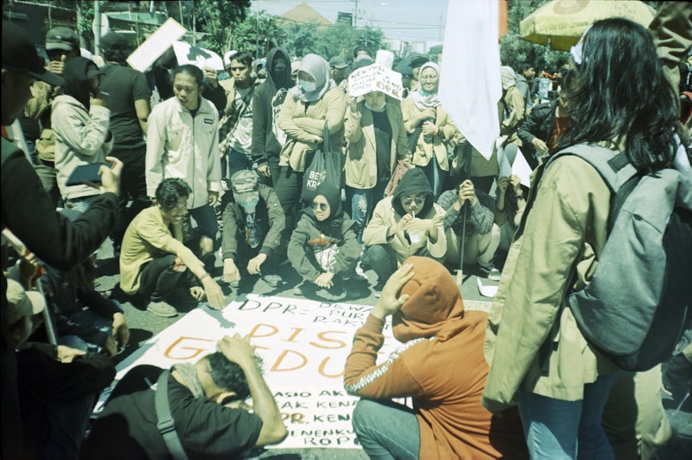 people sitting on white and blue floor during daytime