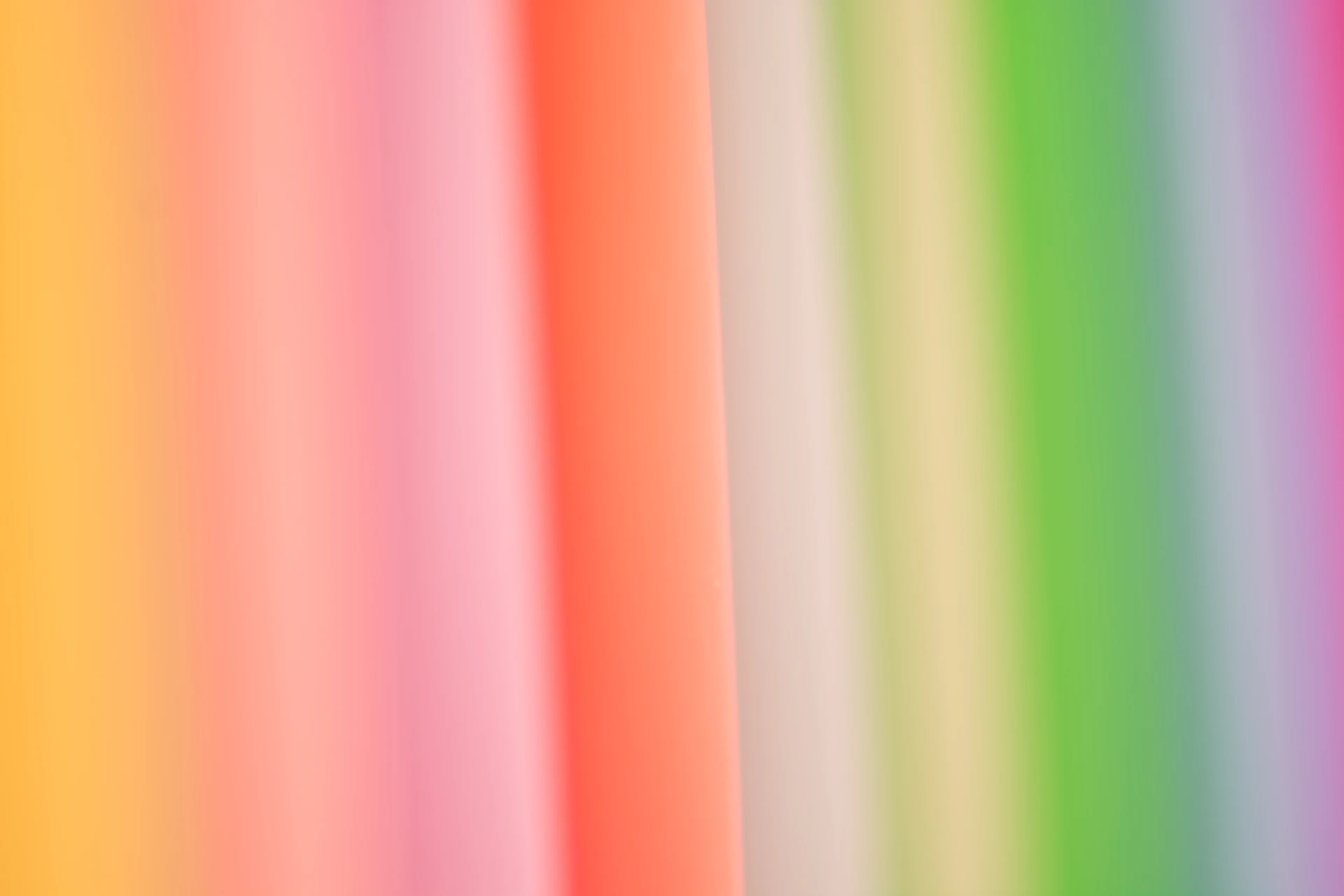 green pink and yellow striped textile