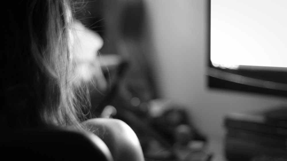 grayscale photo of woman in black shirt