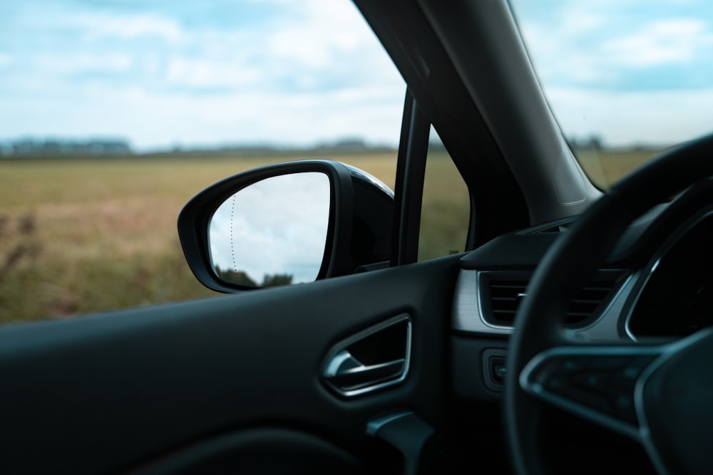 black car side mirror during daytime