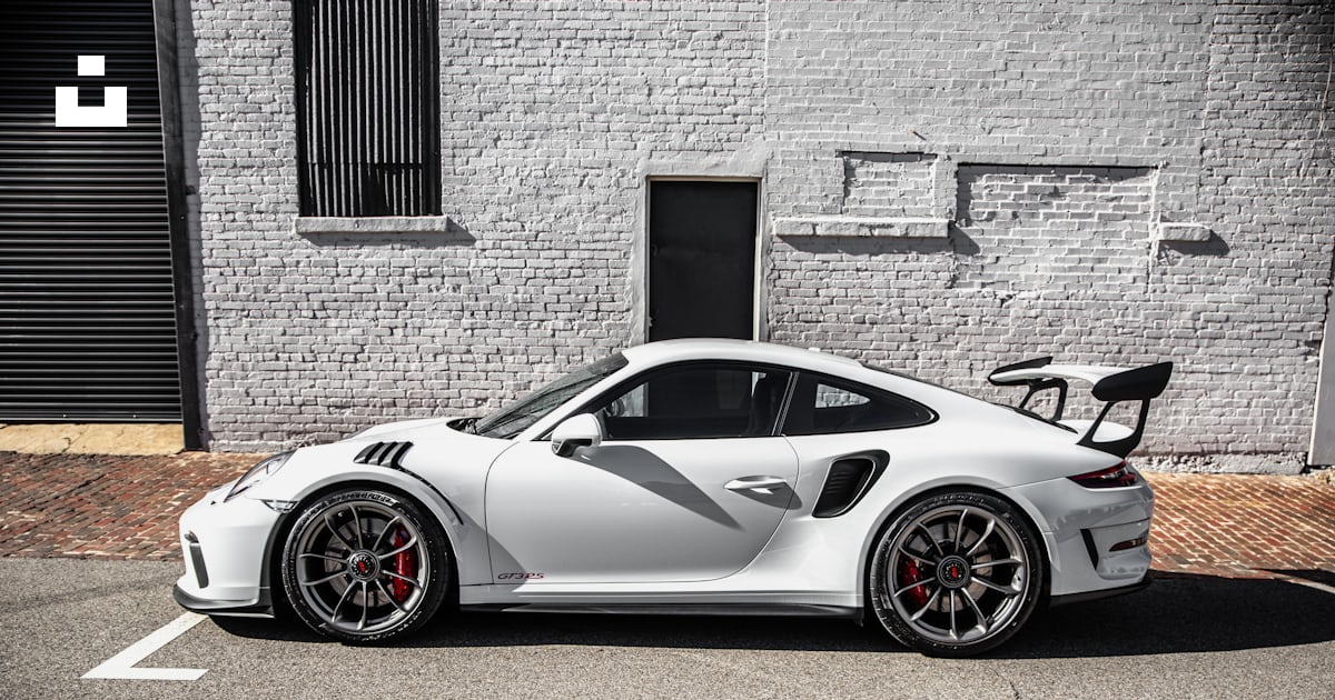 Silver porsche 911 parked beside brown brick wall photo – Free Car ...