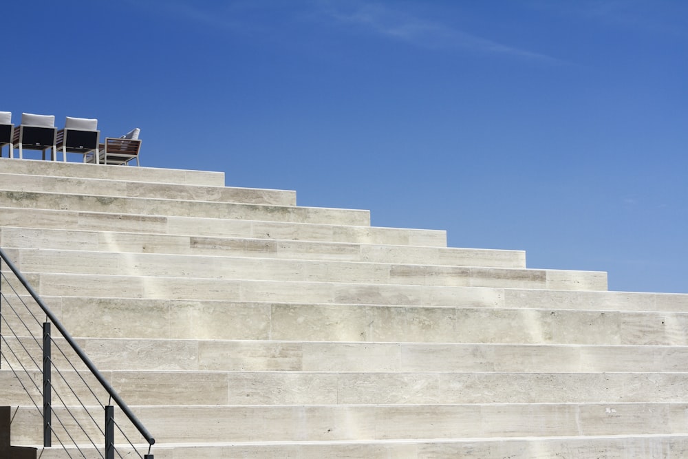 white concrete stairs under blue sky during daytime