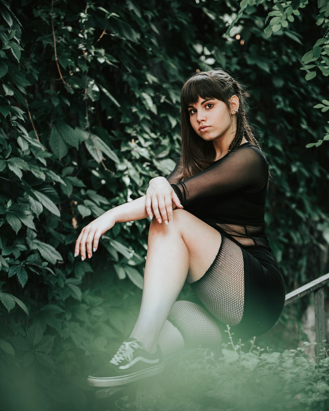 woman in black dress sitting on white chair