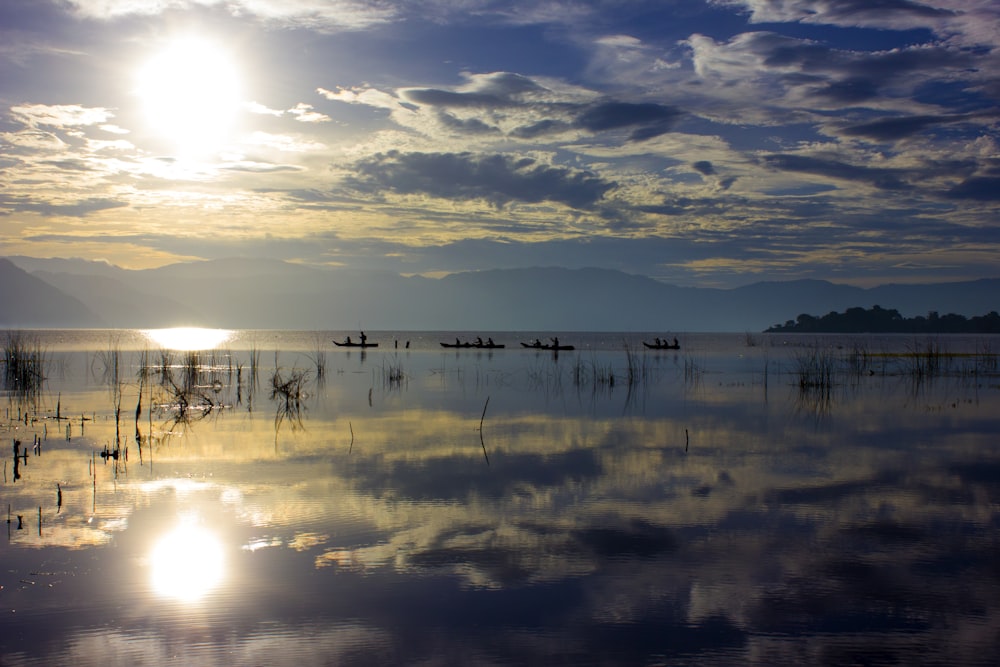 body of water under cloudy sky during daytime