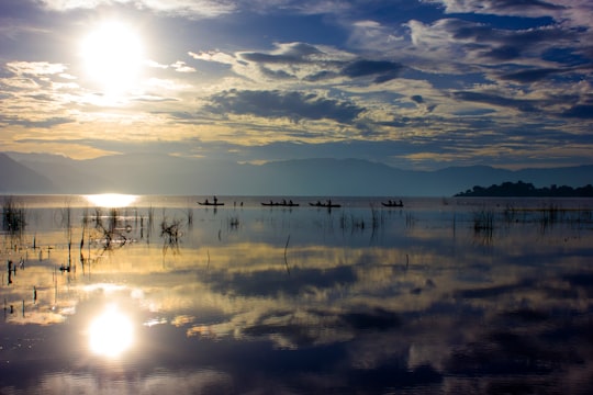 body of water under cloudy sky during daytime in San Juan La Laguna Guatemala