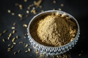 brown powder in silver round bowl