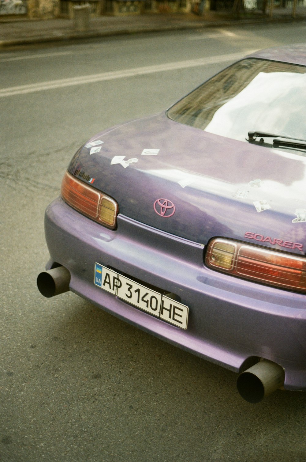 purple bmw m 3 on road during daytime