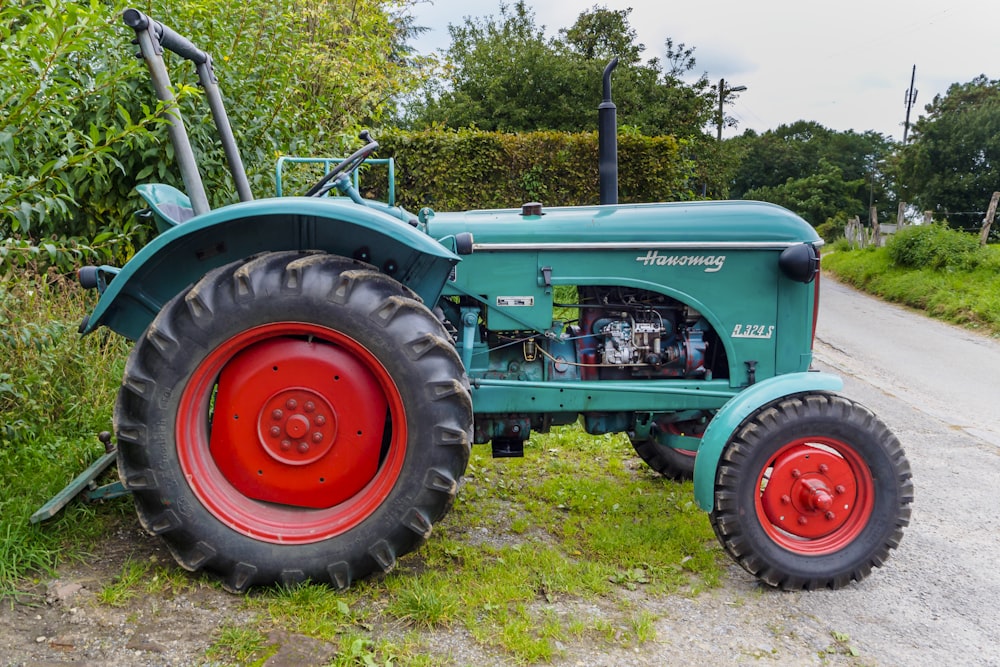 green tractor on green grass field during daytime