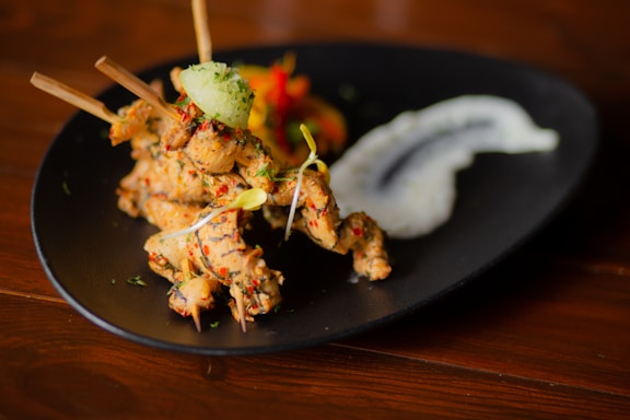 cooked food on black plate