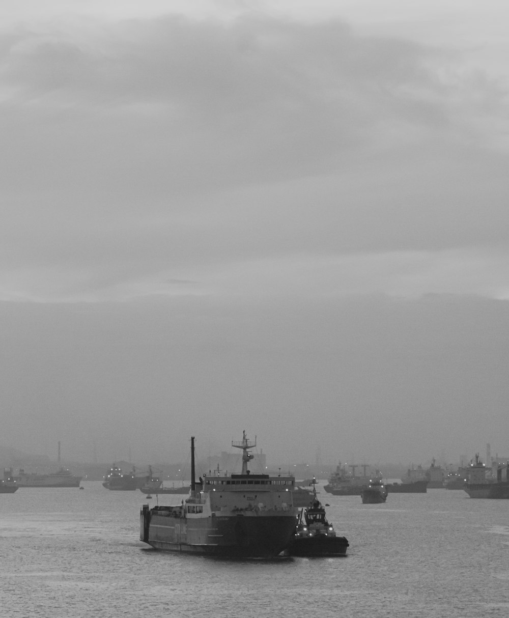 grayscale photo of ship on sea