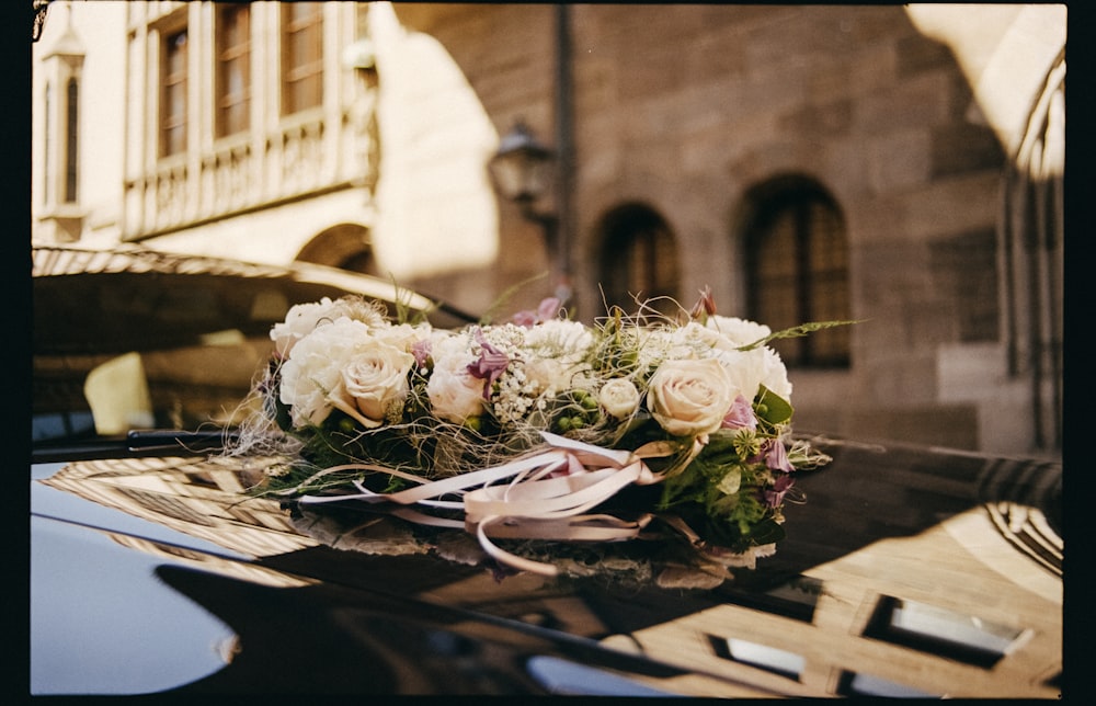 bouquet of white and pink roses on table