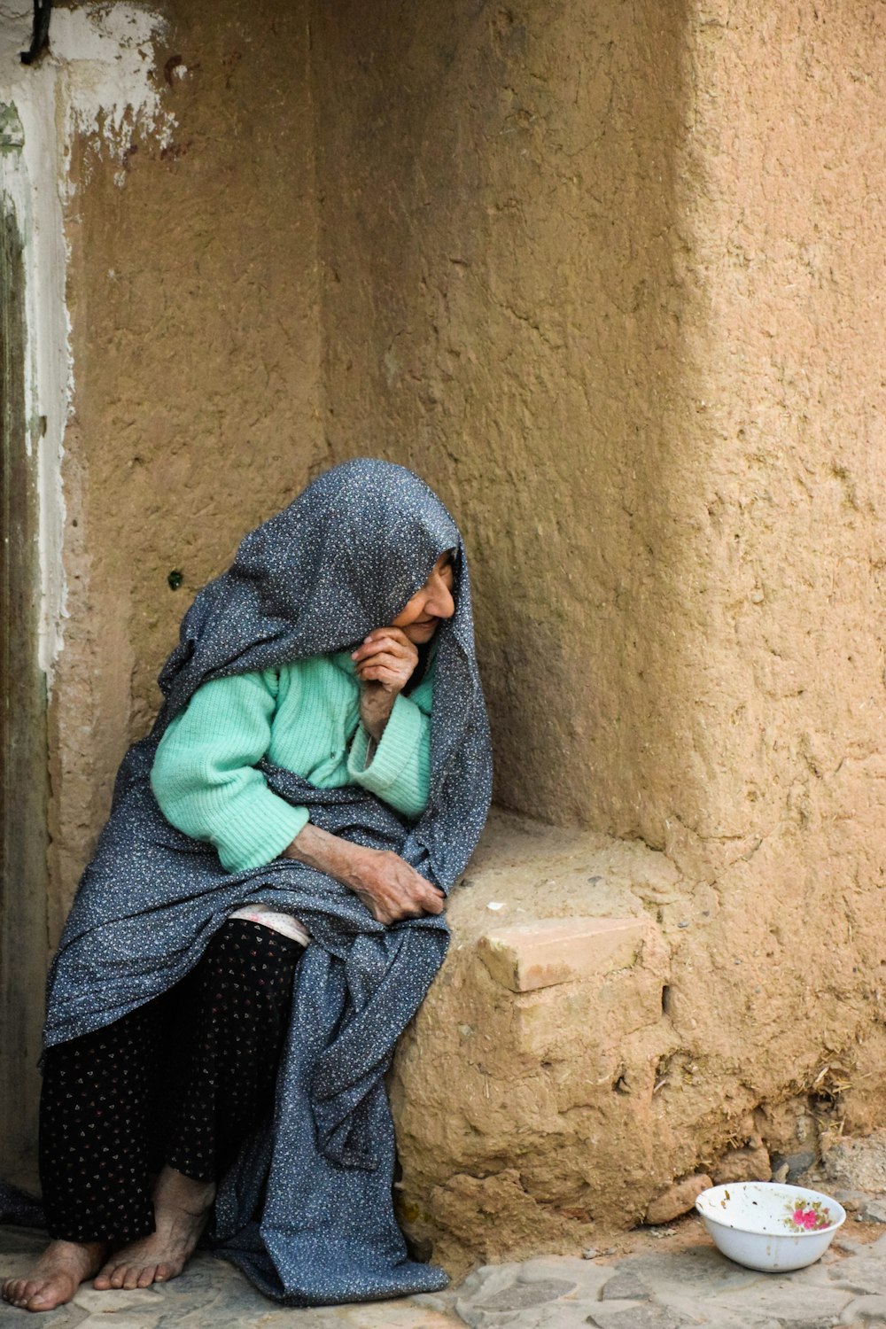 woman in green scarf and black dress