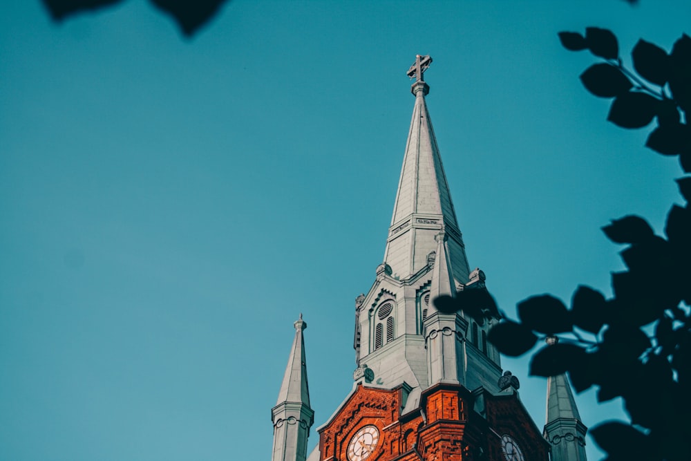 brown and white concrete church under blue sky during daytime