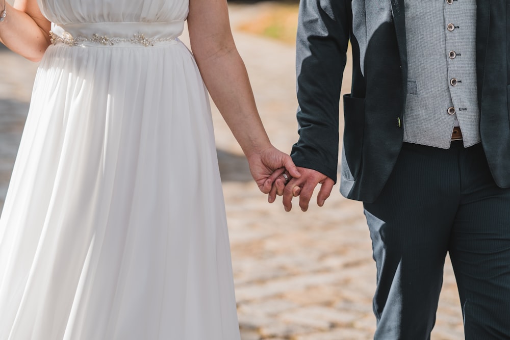 man and woman holding hands